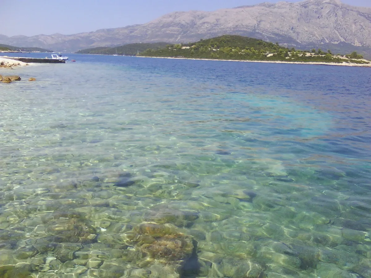 Clear turquoise water over rocks at Planjak island near Korcula on the riviera cruise route